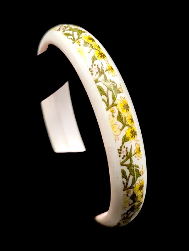 Trendy gold chain bracelets for women -1960s - 1970s Yellow Flowers On White Celluloid Bangle Bracelet