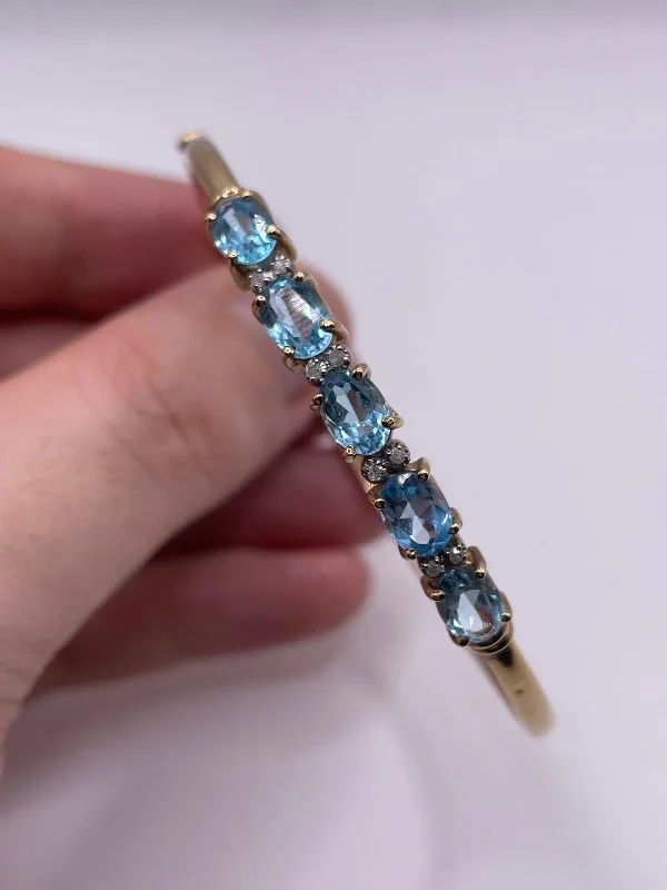 Ladies lightweight tennis bracelets -9ct gold blue topaz and diamond bangle