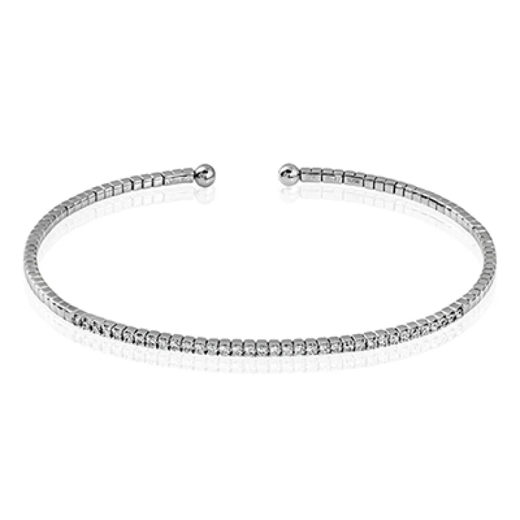 Trendy gemstone cuff bracelets for ladies -A delicate stackable bangle in 18K white gold sparkles with a 1/2 ctw. of shimmering diamonds along the center