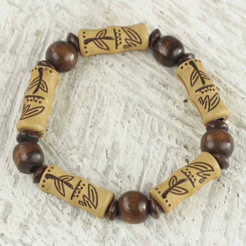 Trendy silver charm bracelets for ladies -Chocolate Escape Artisan Crafted Sese Wood Recycled Plastic Stretch Bracelet